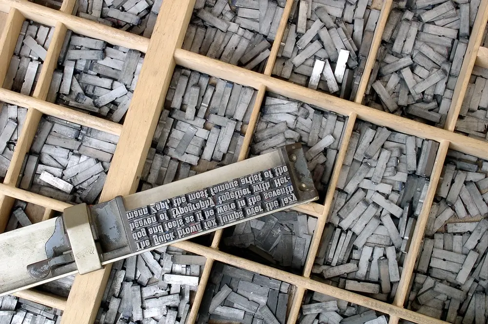 Metal type blocks and composing stick tool.